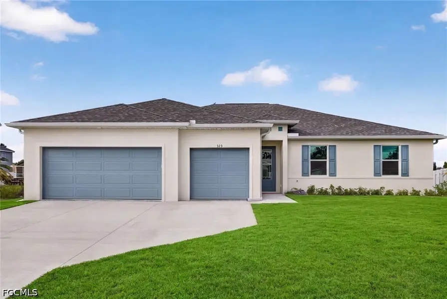 Front exterior of a new home in Cape Coral, Cape Coral, FL, highlighting curb appeal (Image 1). Front exterior of a new home in Cape Coral, Cape Coral, FL, highlighting curb appeal (Image 1).