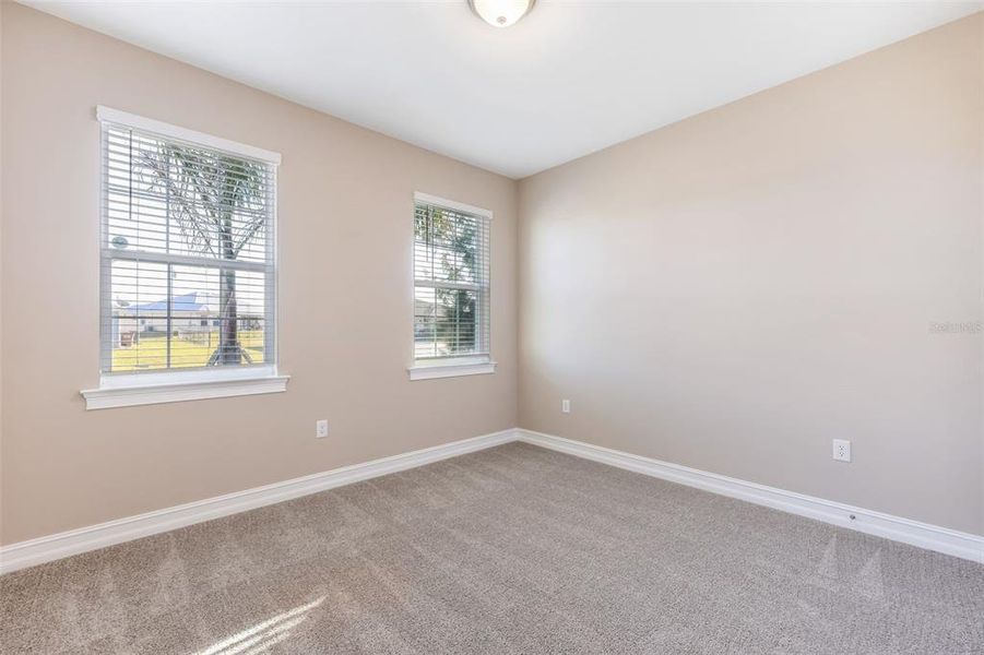 Spacious, unfurnished interior of a new home in Deep Creek Tradition Series, Punta Gorda (Image 20).