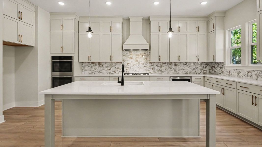 Elevated kitchen features in the Solace II home plan such as a gourmet kitchen with various cabinets and island Elevated kitchen features in the Solace II home plan such as a gourmet kitchen with various cabinets and island