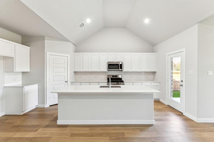 Kitchen in the Wimbledon home plan by Trophy Signature Homes – REPRESENTATIVE PHOTO