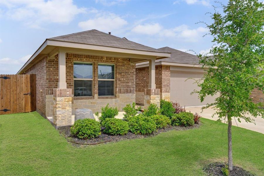 Front exterior of a new home in Cambridge Brook, Denton, TX, highlighting curb appeal (Image 19). Front exterior of a new home in Cambridge Brook, Denton, TX, highlighting curb appeal (Image 19).