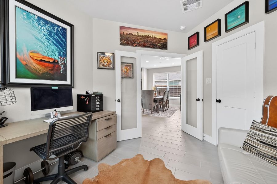 French doors allow for privacy while also being able to see the activities going on outside the office