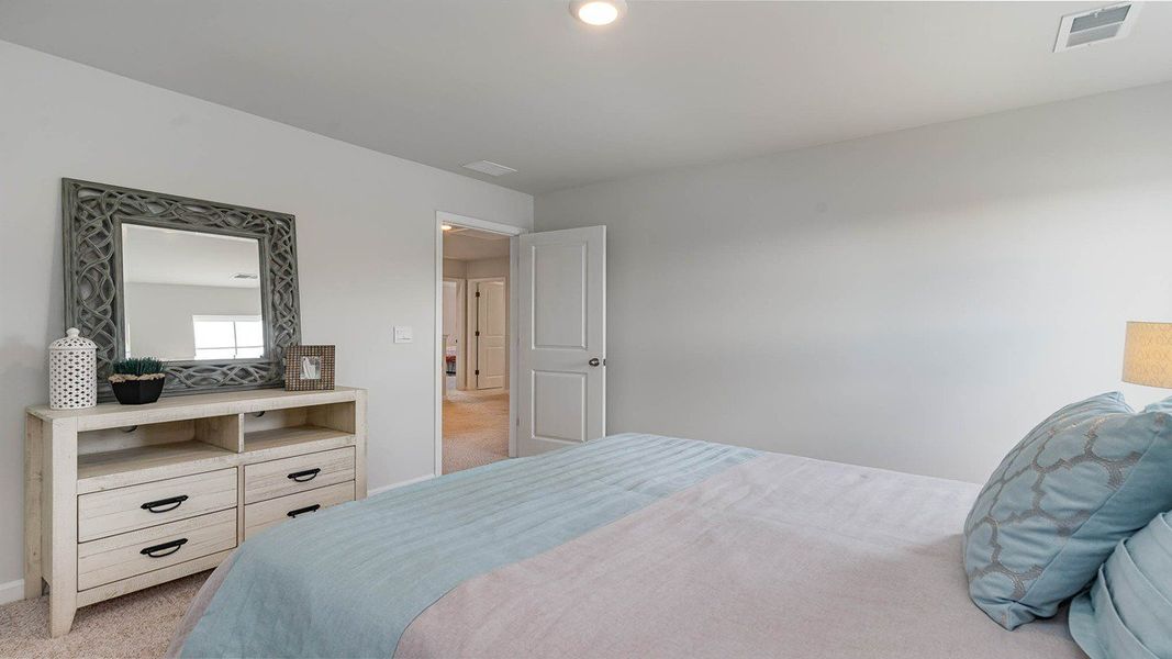 Representative furnished interior of a home built from the TILLMAN by D.R. Horton in Spring View Landing, Loris (Image 25).
