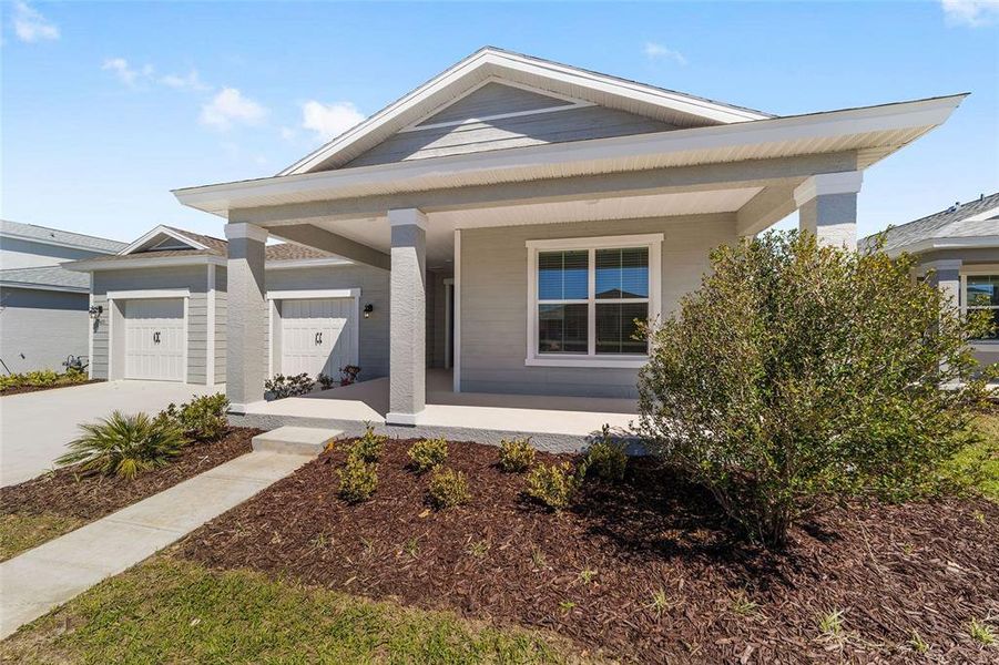 Front exterior of a new home in Calesa Township, Ocala, FL, highlighting curb appeal (Image 21). Front exterior of a new home in Calesa Township, Ocala, FL, highlighting curb appeal (Image 21).