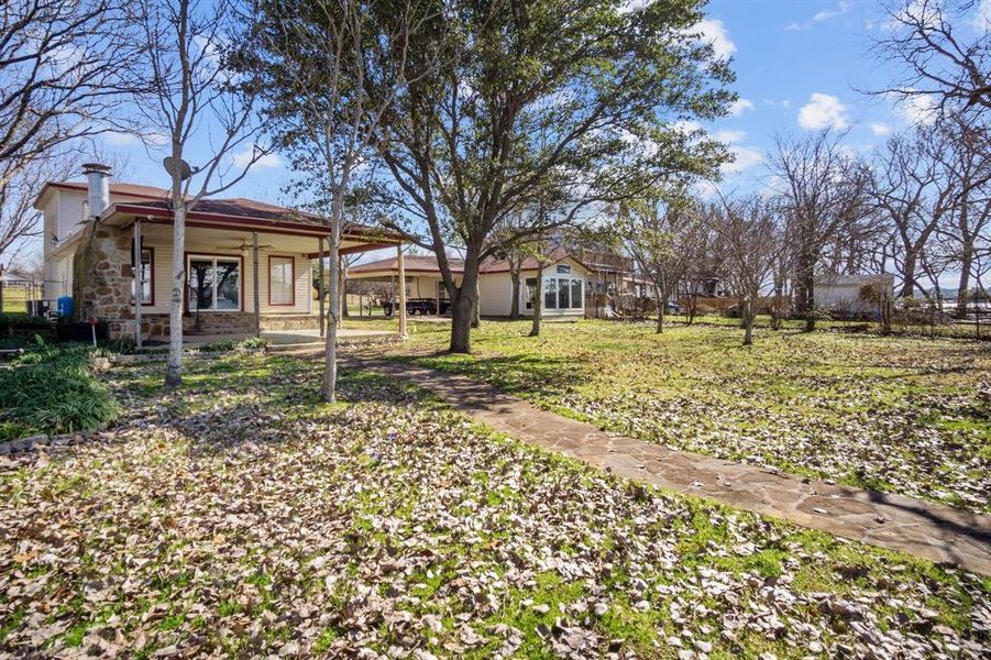 View of yard featuring covered porch