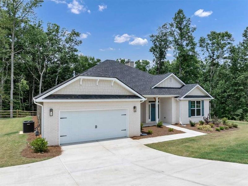 Front exterior of a new home in Tuscany Hills, Douglasville, GA, highlighting curb appeal (Image 22).