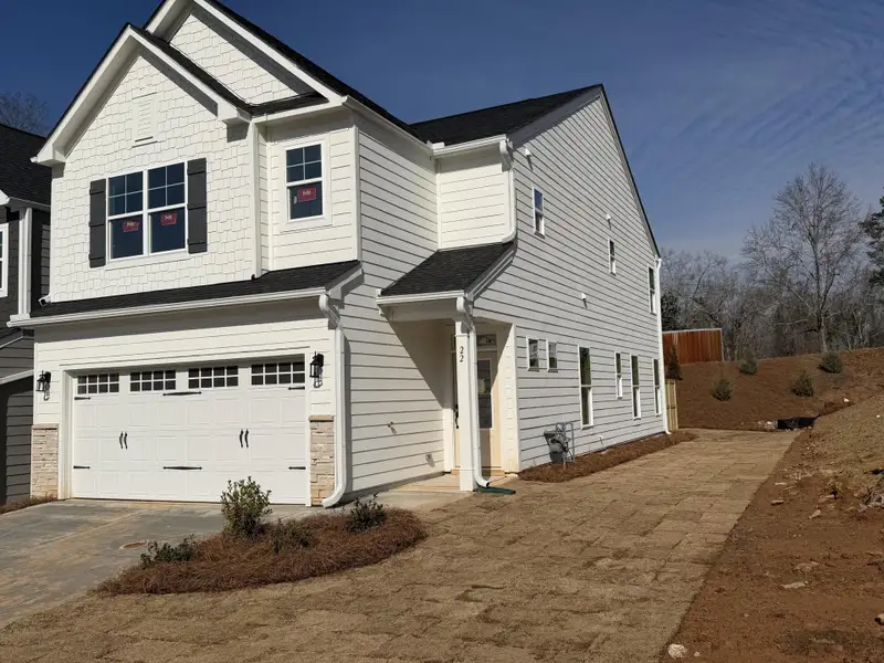 Front exterior of a new home in Villas at Dawsonville Townhomes, Dawsonville, GA, highlighting curb appeal (Image 2).