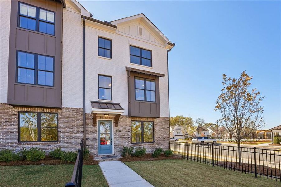 Front exterior of a new home in Palisades Townhomes, Cumming, GA, highlighting curb appeal (Image 25).
