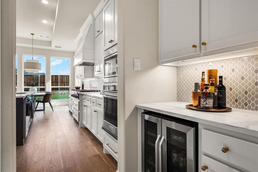 Coffee Bar or wine bar complete with a wine fridge.