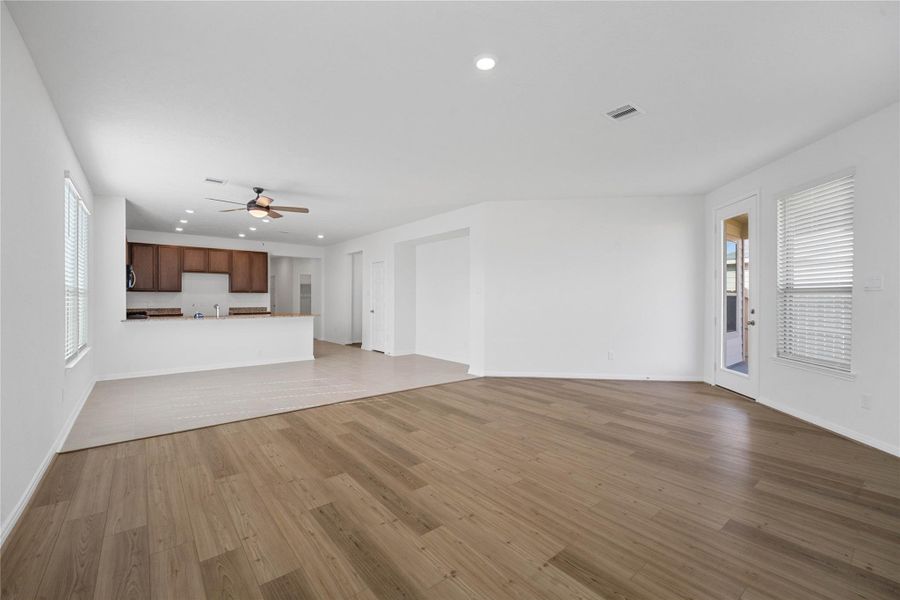 Beautiful open-concept layout effortlessly uniting the family, dining, and kitchen spaces—ideal for everyday comfort and entertaining guests!