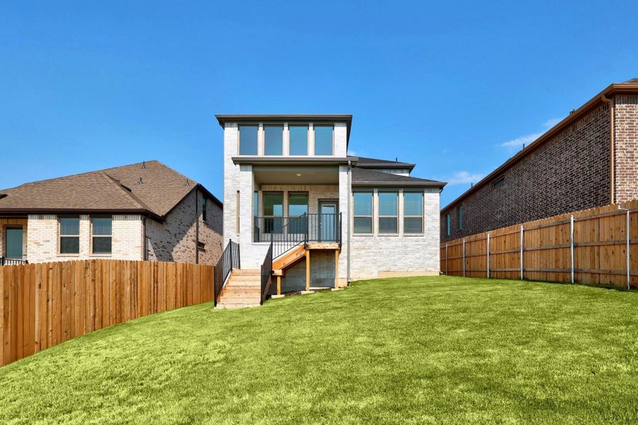 Front exterior of a new home in Lakeside at Tessera, Lago Vista, TX, highlighting curb appeal (Image 19). Front exterior of a new home in Lakeside at Tessera, Lago Vista, TX, highlighting curb appeal (Image 19).
