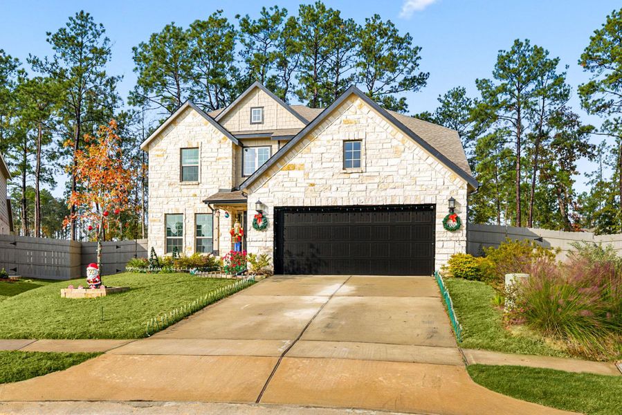 Front exterior of a new home in ARTAVIA: Fairway Collection, Conroe, TX, highlighting curb appeal (Image 23).