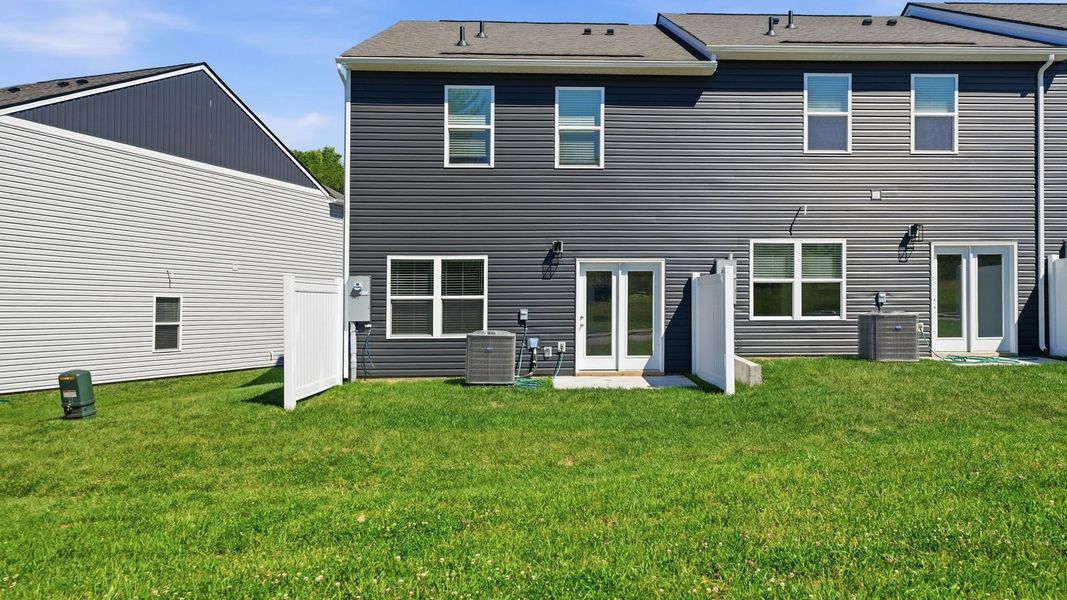 Exterior details and patio area of a home in The Arbor Townhomes, Kingsport (Image 19).