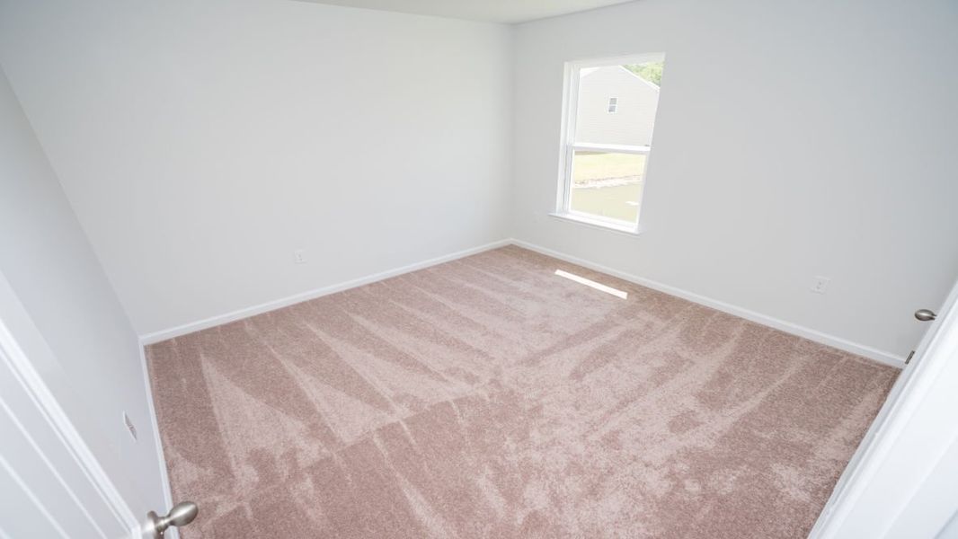 Representative unfurnished interior of a home built from the ROBIE by D.R. Horton in Indigo Preserve, Leland (Image 25).