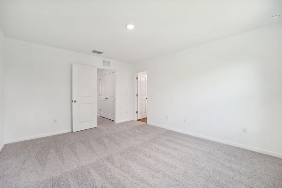 Spacious, unfurnished interior of a new home in Aster Towns, Summerville (Image 10).