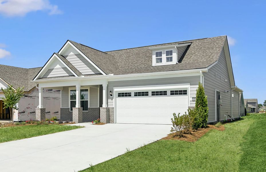 Front exterior of a new home in Del Webb Southern Harmony, Murfreesboro, TN, highlighting curb appeal (Image 27).