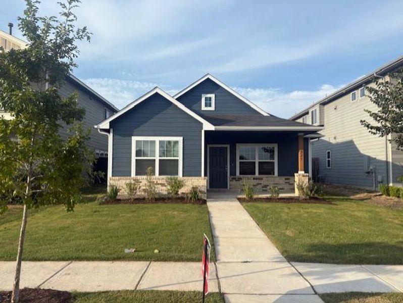 Front exterior of a new home in Brooklands, Hutto, TX, highlighting curb appeal (Image 1). Front exterior of a new home in Brooklands, Hutto, TX, highlighting curb appeal (Image 1).