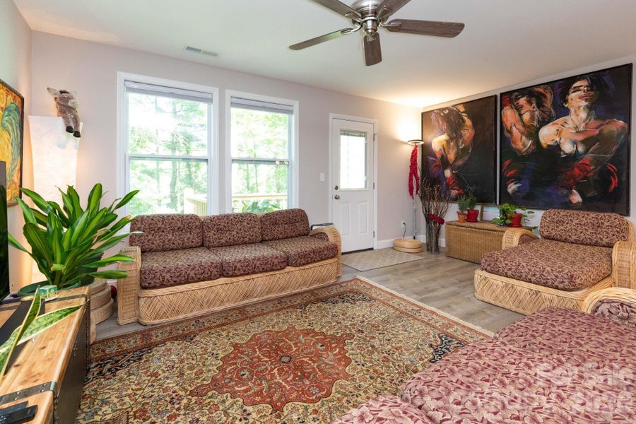Living space with easy access to back deck. Living space with easy access to back deck.