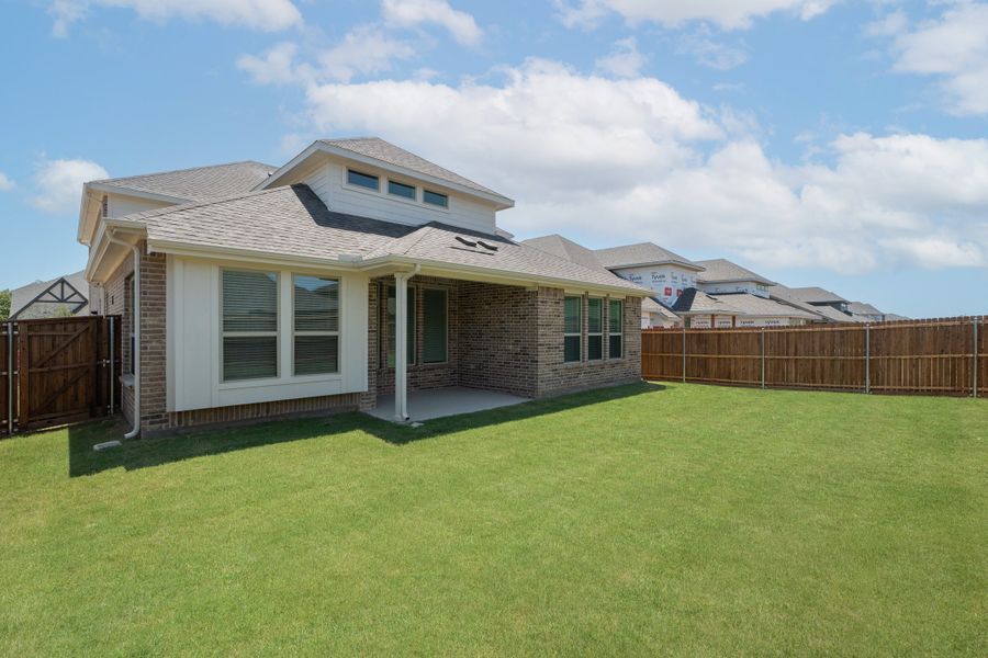 Exterior details and patio area of a home in Valencia on the Lake, Little Elm (Image 2).