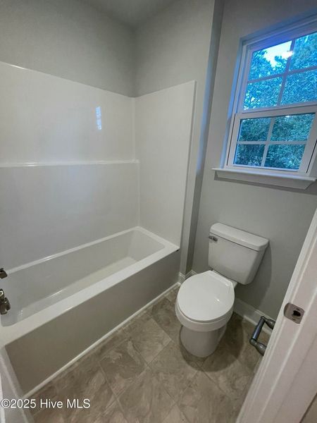 Furnished interior view inside a new home in Mill Creek Cove, Bolivia (Image 10).