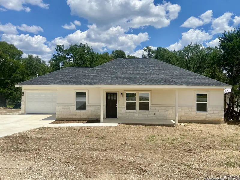 Front exterior of a new home in , Canyon Lake, TX, highlighting curb appeal (Image 11). Front exterior of a new home in , Canyon Lake, TX, highlighting curb appeal (Image 11).