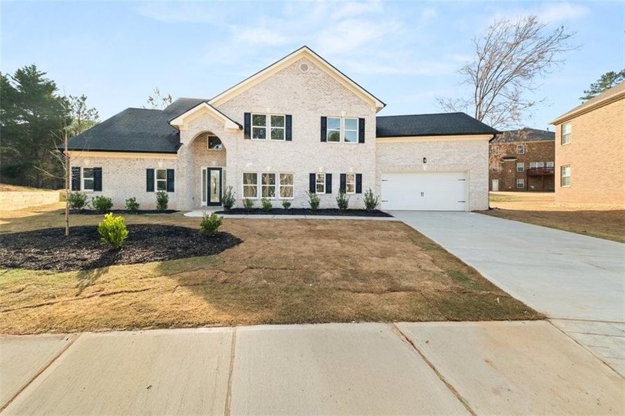 Front exterior of a new home in , Stonecrest, GA, highlighting curb appeal (Image 1).