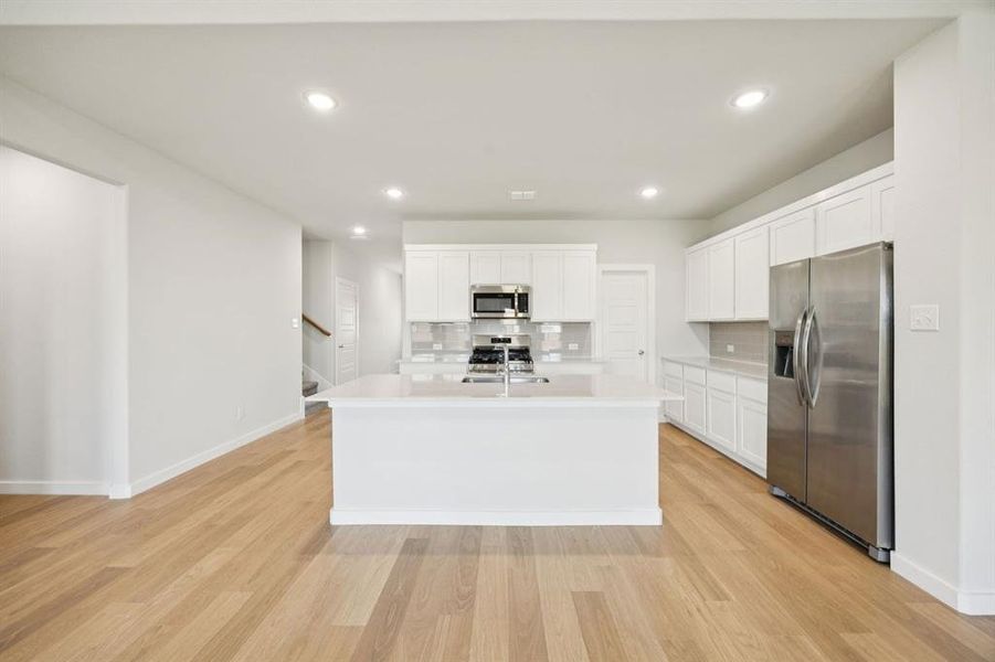 Kitchen in the Masters home plan by Trophy Signature Homes – REPRESENTATIVE PHOTO