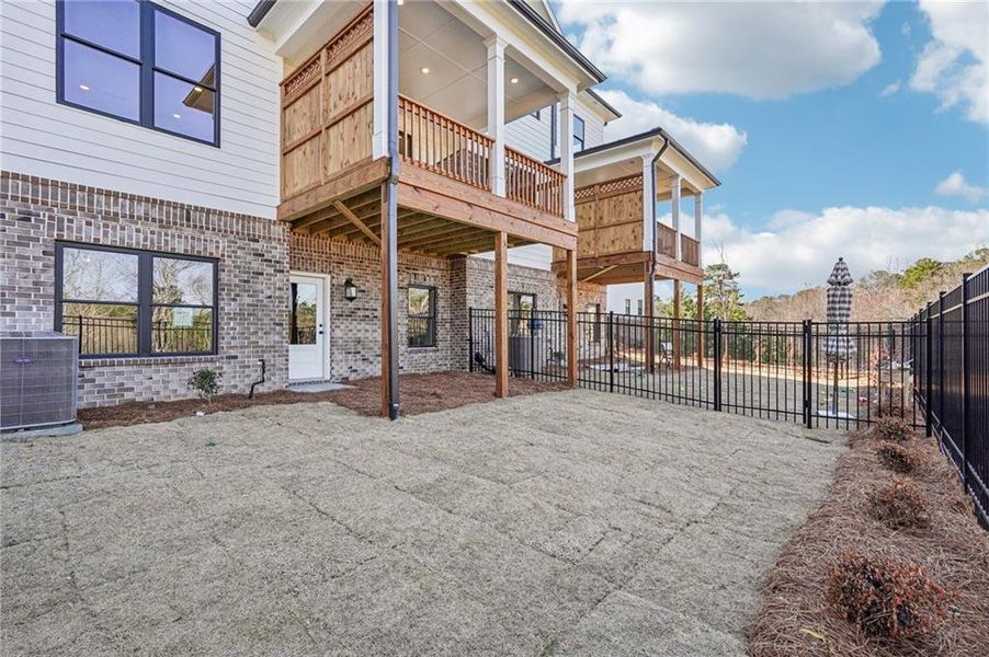 Exterior details and patio area of a home in Millcroft Townhomes, Buford (Image 27). Exterior details and patio area of a home in Millcroft Townhomes, Buford (Image 27).