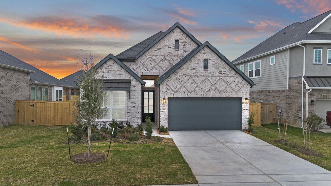 Front exterior of a new home in Mulberry Farms, Santa Fe, TX, highlighting curb appeal (Image 18).