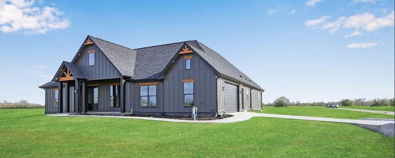 Front exterior of a new home in , Angleton, TX, highlighting curb appeal (Image 25).
