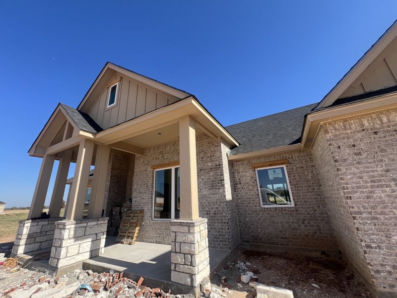 Front exterior of a new home in Zion Valley, Poolville, TX, highlighting curb appeal (Image 2).