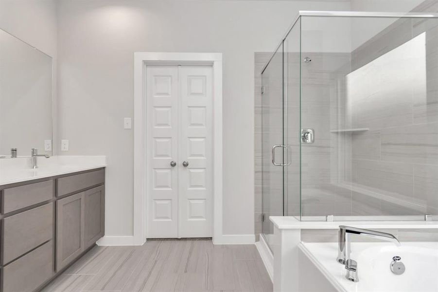 Escape to a spa-like oasis in this primary bathroom. Sample photo of completed home with similar floor plan. As-built interior colors and selections may vary.