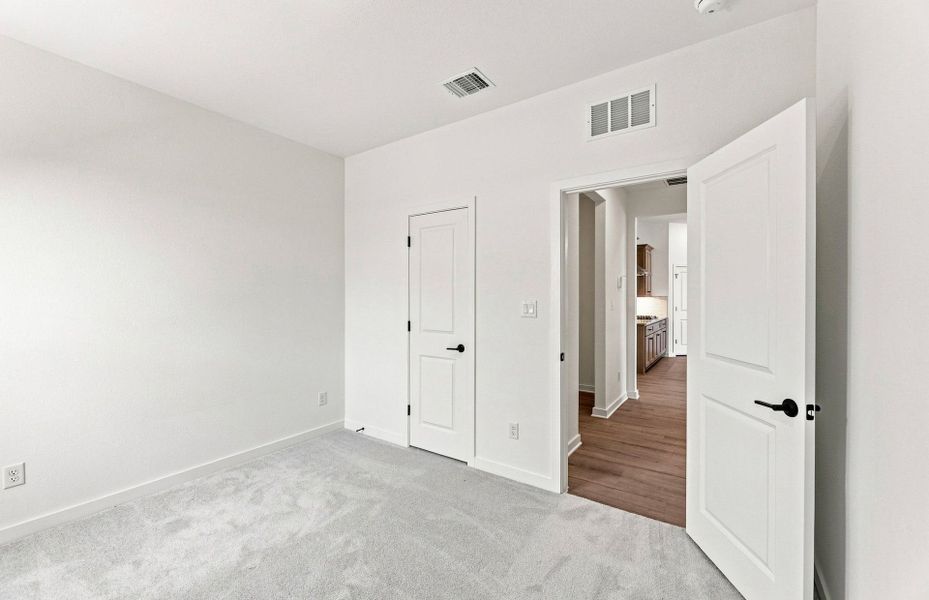 Representative unfurnished interior of a home built from the Elliott by Pulte Homes in West Cypress Hills, Spicewood (Image 17).