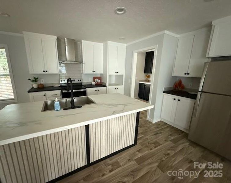 Kitchen area with lots of counter and cabinet space, stainless steel appliances Kitchen area with lots of counter and cabinet space, stainless steel appliances