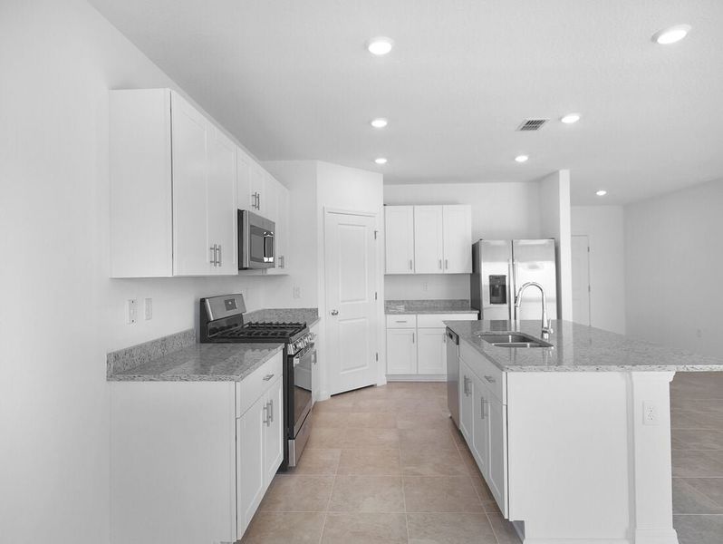 Representative furnished interior of a home built from the Azalea by Taylor Morrison in Palm Wind, Hudson (Image 38).