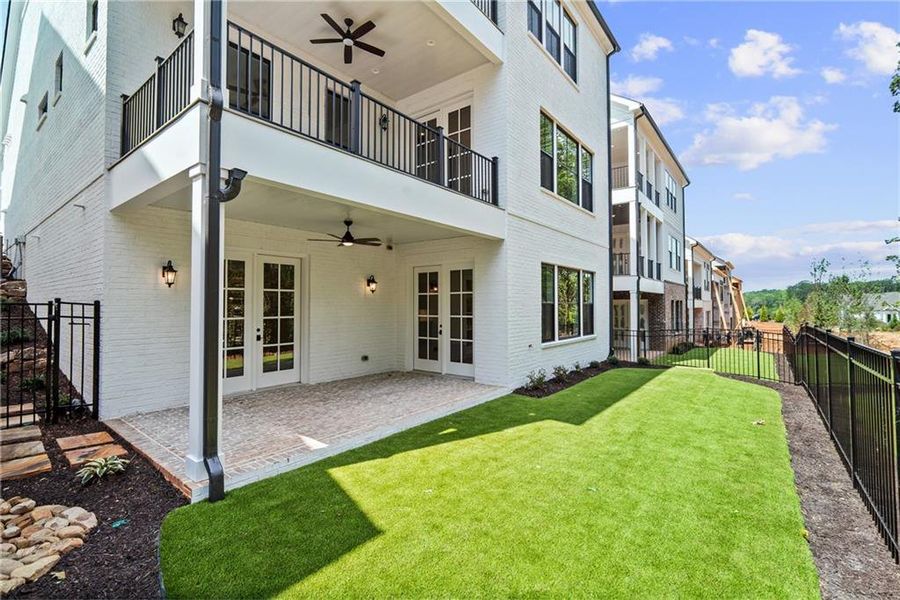 Exterior details and patio area of a home in Waterside Single Family, Norcross (Image 25).