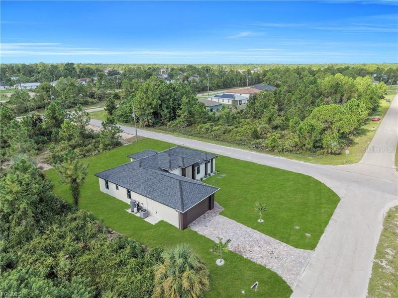 Front exterior of a new home in , Lehigh Acres, FL, highlighting curb appeal (Image 28).