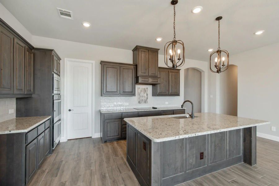 Kitchen | Concept 2586 at Hidden Creek Estates in Van Alstyne, TX by Landsea Homes