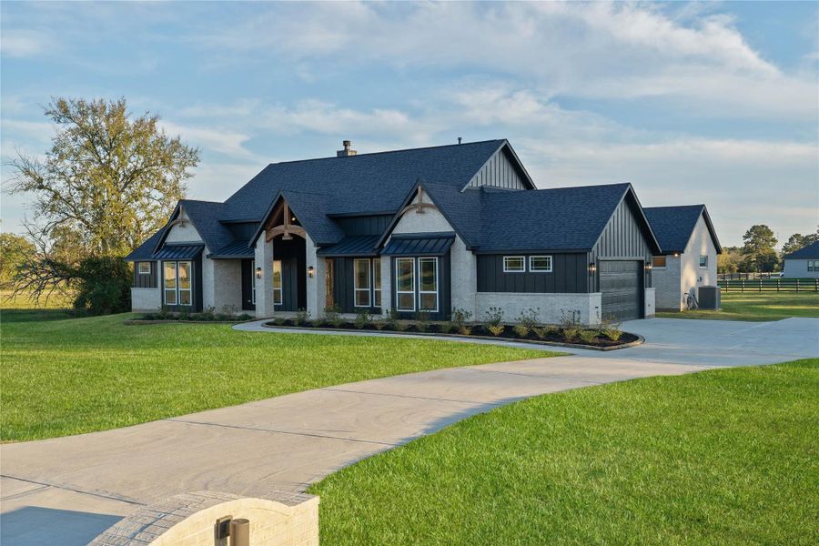 Front exterior of a new home in , Montgomery, TX, highlighting curb appeal (Image 25). Front exterior of a new home in , Montgomery, TX, highlighting curb appeal (Image 25).