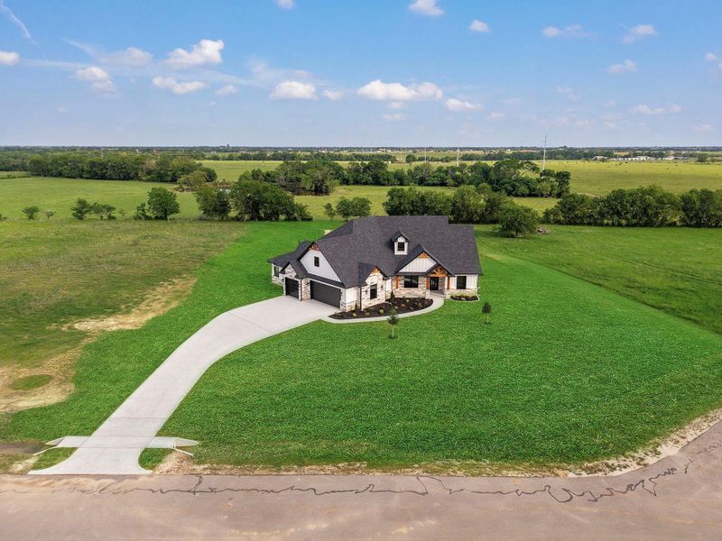 Front exterior of a new home in , Bryan, TX, highlighting curb appeal (Image 29).