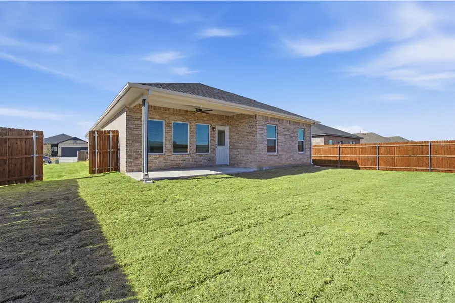 Exterior details and patio area of a home in Pebblebrook, Sherman (Image 3).