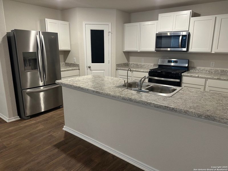 Furnished interior view inside a new home in Valley Ranch, San Antonio (Image 3).