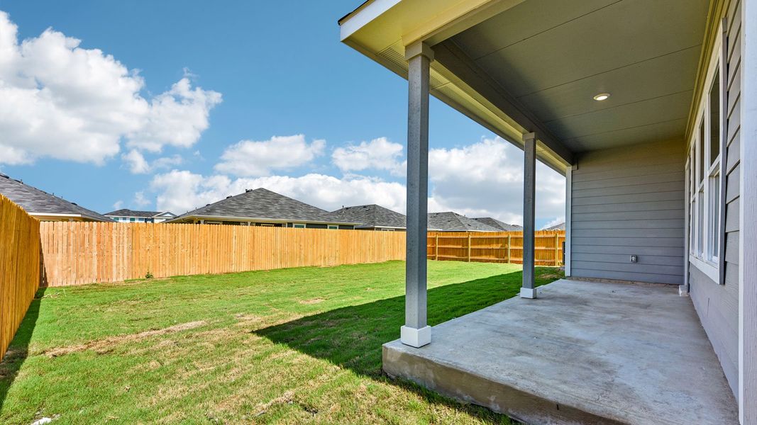 Exterior details and patio area of a home in Monarch Ranch, Manor (Image 4).
