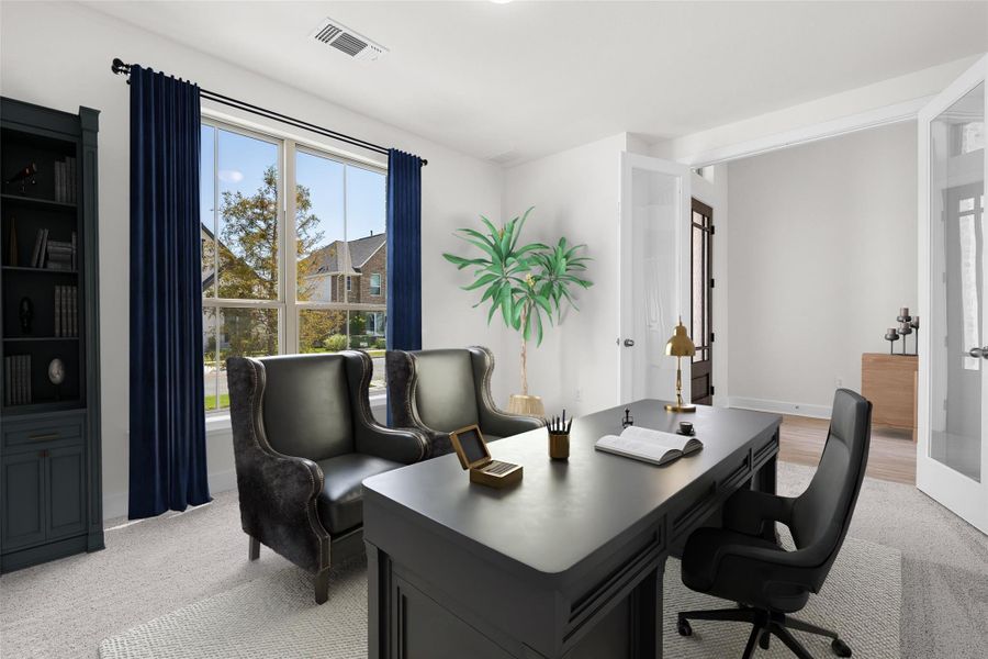 Office space with light colored carpet and baseboards
