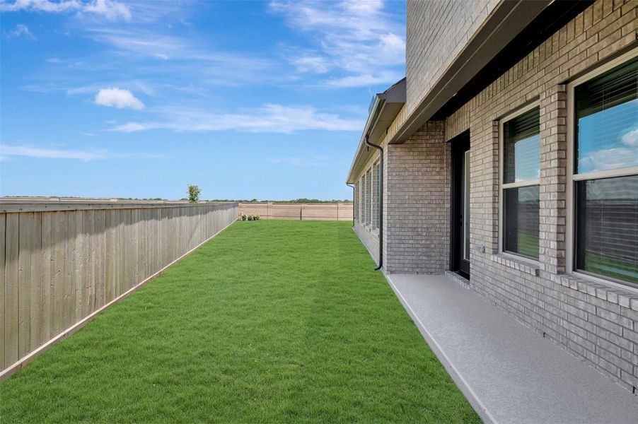 Exterior details and patio area of a home in Prairieland Village - Grove Collection, Cypress (Image 28). Exterior details and patio area of a home in Prairieland Village - Grove Collection, Cypress (Image 28).