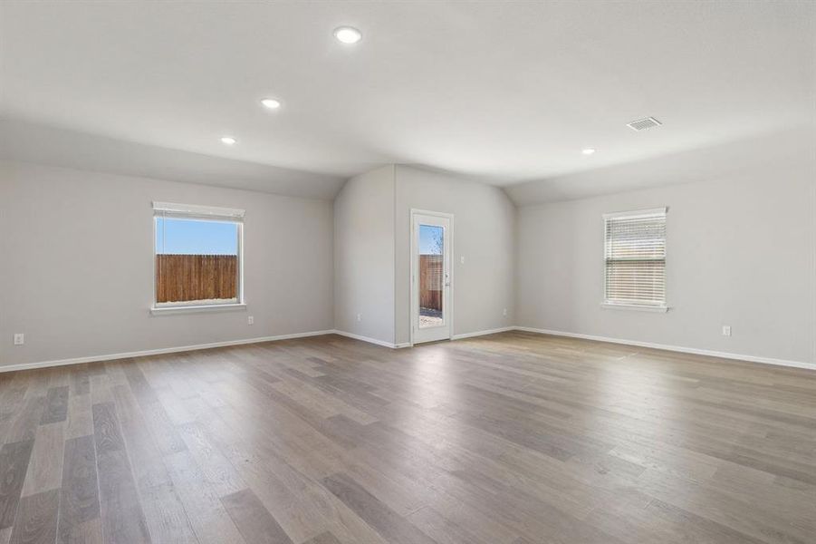 Dining and Living Room in the Harrison home plan by Trophy Signature Homes – REPRESENTATIVE PHOTO