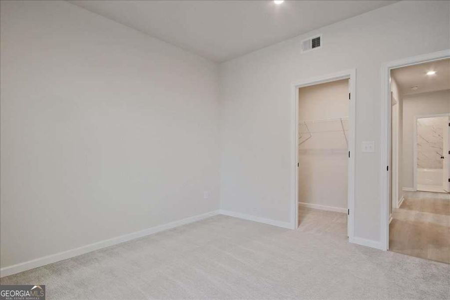 Spacious, unfurnished interior of a new home in The Paddocks at Doc Hughes, Buford (Image 50).