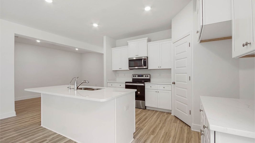 Representative furnished interior of a home built from the Kennedy by D.R. Horton in Bayside at Ward Creek, Panama City Beach (Image 8).