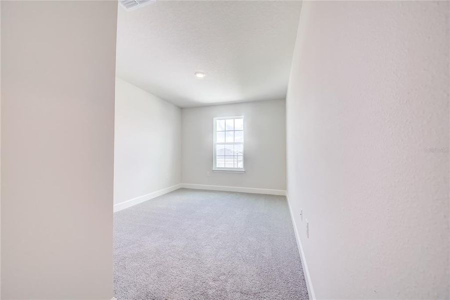 Spacious, unfurnished interior of a new home in Aviary at Rutland Ranch, Parrish (Image 16).