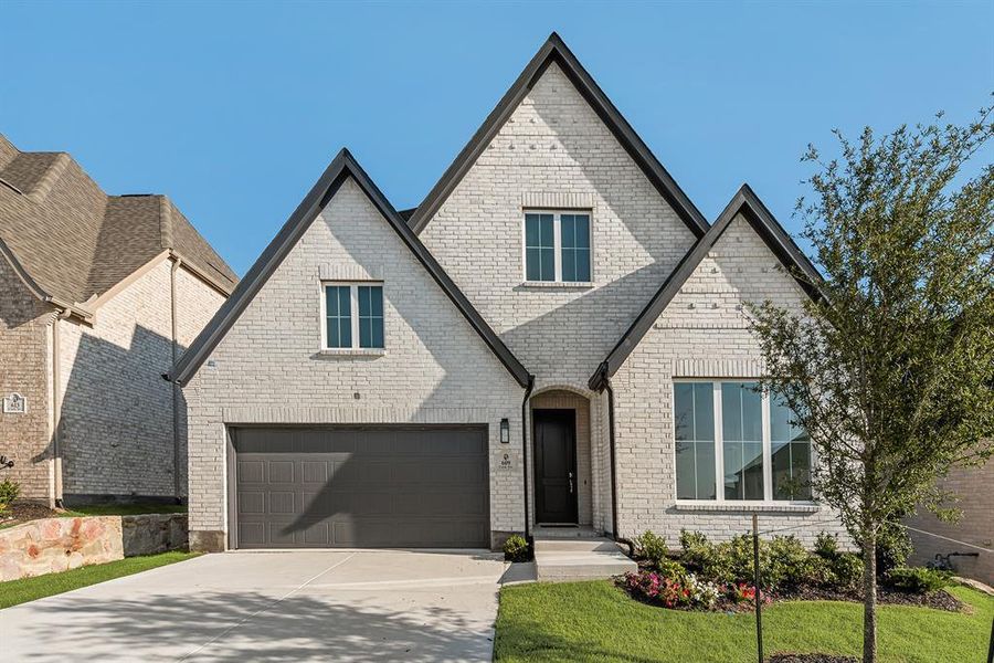 Front exterior of a new home in Hillside Village, Celina, TX, highlighting curb appeal (Image 2). Front exterior of a new home in Hillside Village, Celina, TX, highlighting curb appeal (Image 2).